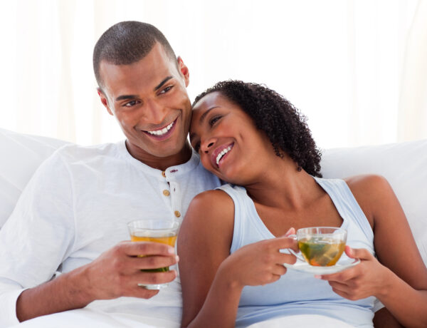 photodune-8162584-happy-ethnic-couple-drinking-a-cup-of-tea-on-their-bed-m