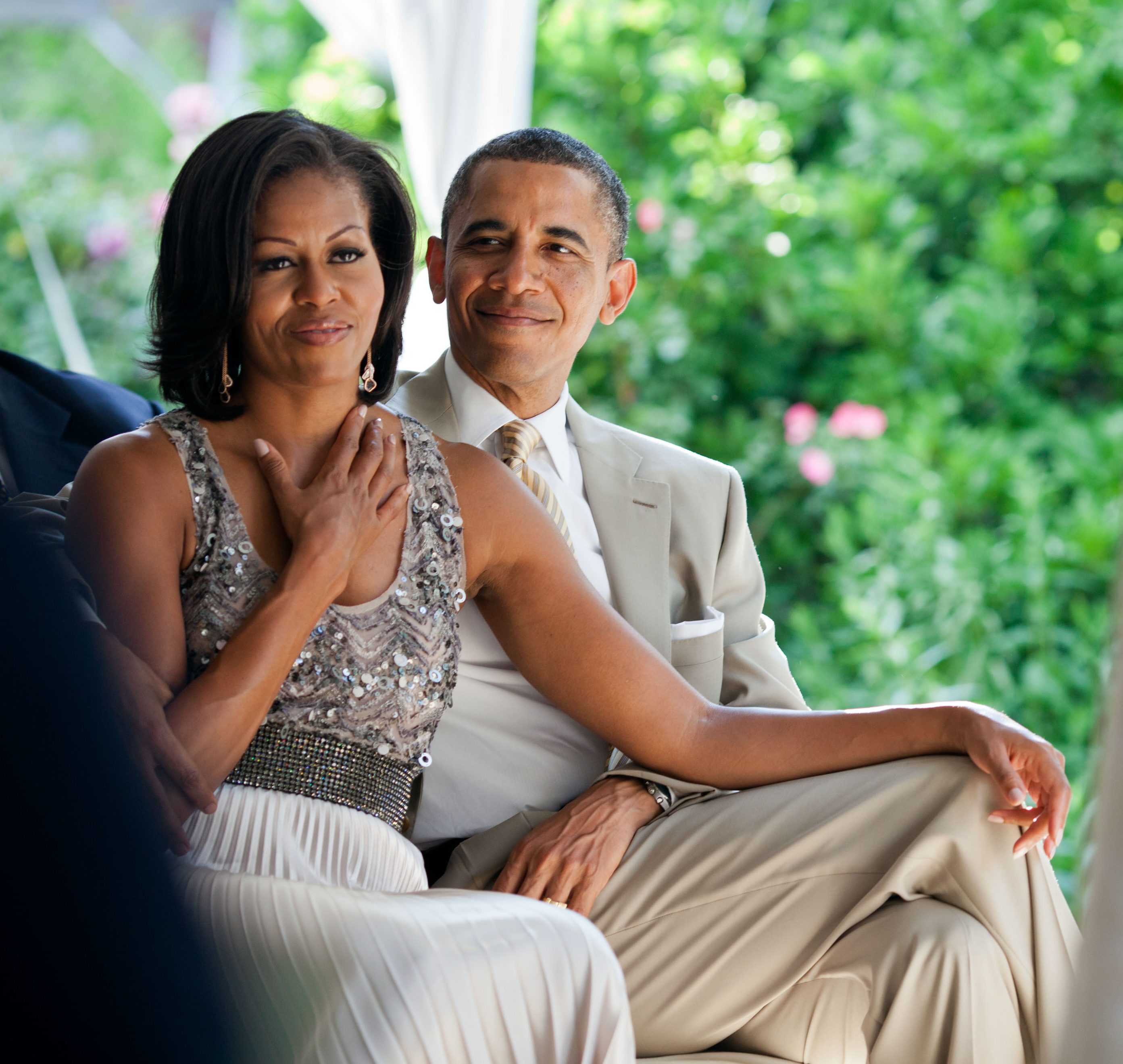 June 18, 2012 "The First Lady reacts as she watches Laura Jarrett and Tony Balkissoon take their vows during their wedding at Valerie Jarrett's home in Chicago." (Official White House Photo by Pete Souza) This official White House photograph is being made available only for publication by news organizations and/or for personal use printing by the subject(s) of the photograph. The photograph may not be manipulated in any way and may not be used in commercial or political materials, advertisements, emails, products, promotions that in any way suggests approval or endorsement of the President, the First Family, or the White House.
